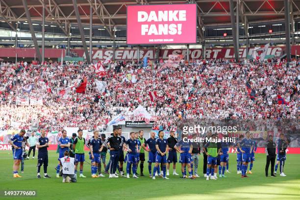 Players of FC Schalke 04, acknowledge the fans after the team's defeat leading to their relegation after the Bundesliga match between RB Leipzig and...