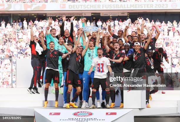 Manuel Neuer of FC Bayern Munich lifts the Bundesliga Meisterschale trophy after the team's victory in the Bundesliga match between 1. FC Köln and FC...