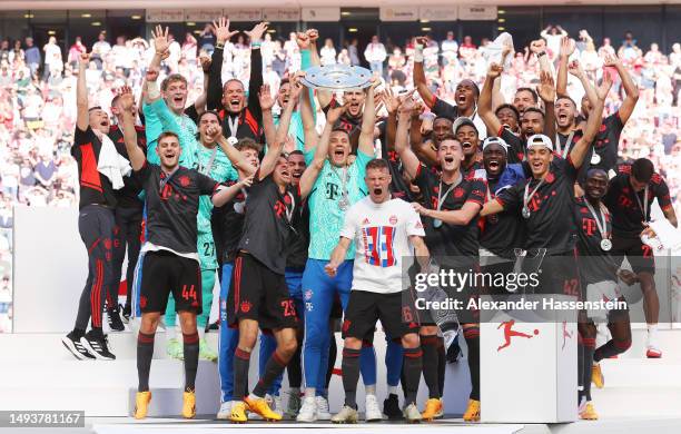 Manuel Neuer of FC Bayern Munich lifts the Bundesliga Meisterschale trophy after the team's victory in the Bundesliga match between 1. FC Köln and FC...