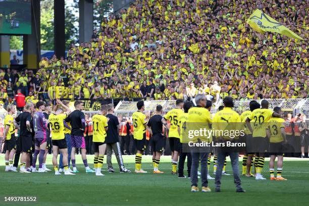 Borussia Dortmund players look dejected following the team's draw, as they finish second in the Bundesliga behind FC Bayern Munich during the...