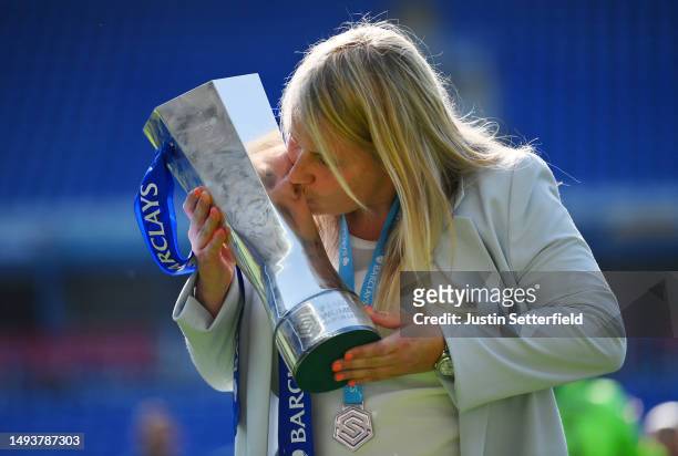 Emma Hayes, Manager of Chelsea, lifts the Barclays Women's Super League trophy after the team's victory during the FA Women's Super League match...