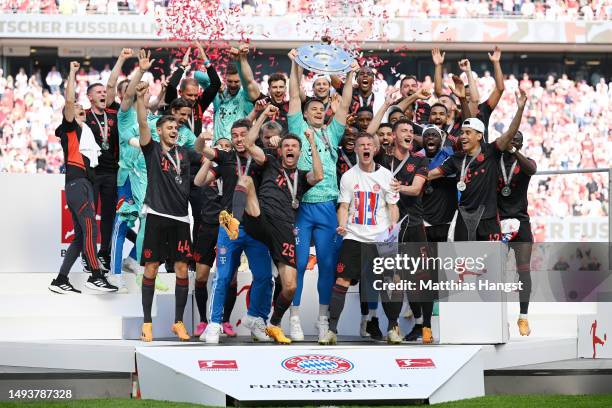 Manuel Neuer of FC Bayern Munich lifts the Bundesliga Meisterschale trophy after the team's victory in the Bundesliga match between 1. FC Köln and FC...