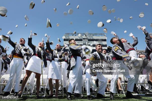 Graduation cadets toss their hats into the air following the conclusion of ceremonies at Michie Stadium at West Point's graduation on May 27, 2023 in...