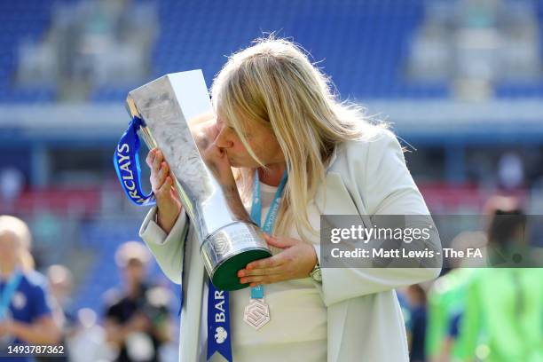 Emma Hayes, Manager of Chelsea, lifts the Barclays Women's Super League trophy after the team's victory during the FA Women's Super League match...