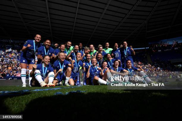 Chelsea players celebrate with the Barclays Women's Super League trophy after the team's victory during the FA Women's Super League match between...