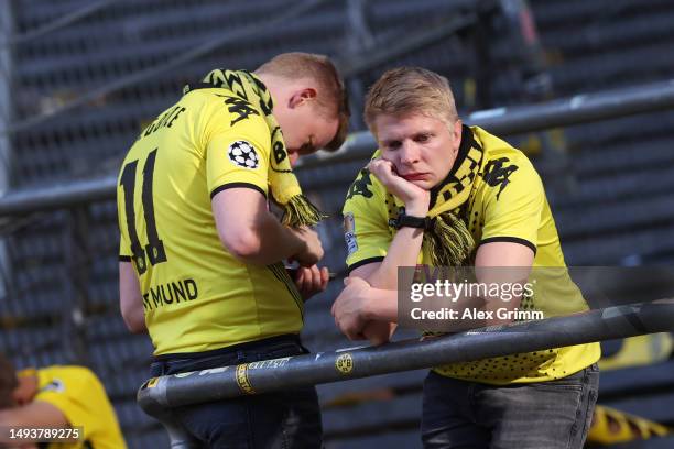 Borussia Dortmund fans look dejected following the team's draw, as they finish second in the Bundesliga behind FC Bayern Munich during the Bundesliga...