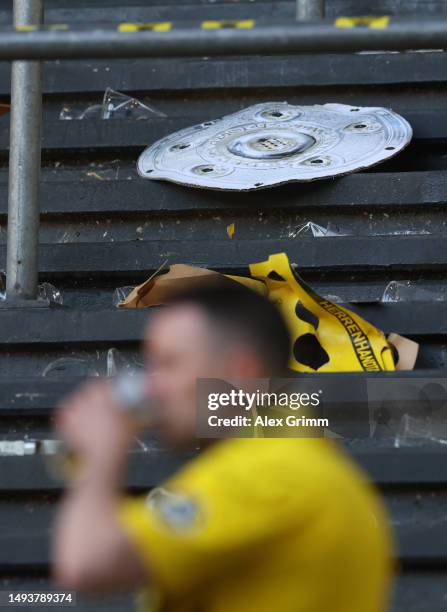 Model Bundesliga Meisterschale trophy is seen on the ground as Borussia Dortmund finish second behind FC Bayern Munich after the draw during the...