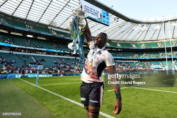 Maro Itoje of Saracens lifts the Gallagher Premiership trophy after the team's victory during the Gallagher Premiership Final between Saracens and...