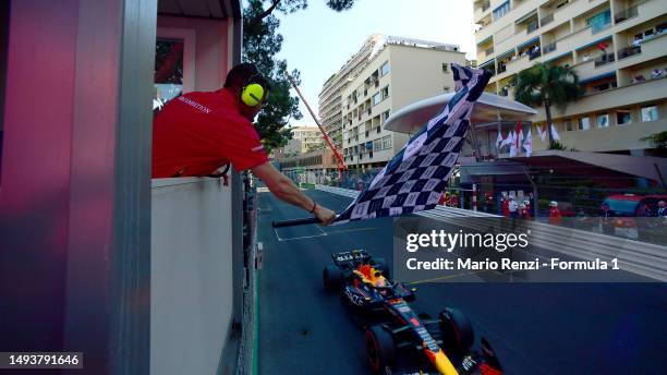 Pole position qualifier Max Verstappen of the Netherlands driving the Oracle Red Bull Racing RB19 takes the chequered flag during qualifying ahead of...