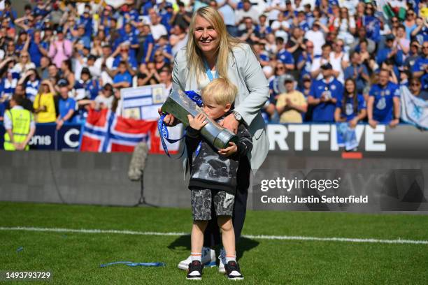 Emma Hayes, Manager of Chelsea, celebrates with the Barclays Women's Super League trophy and family after the team's victory during the FA Women's...