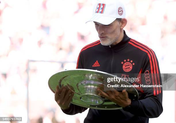 Thomas Tuchel, Head Coach of FC Bayern Munich, celebrates with the Bundesliga Meisterschale trophy after the team's victory in the Bundesliga match...