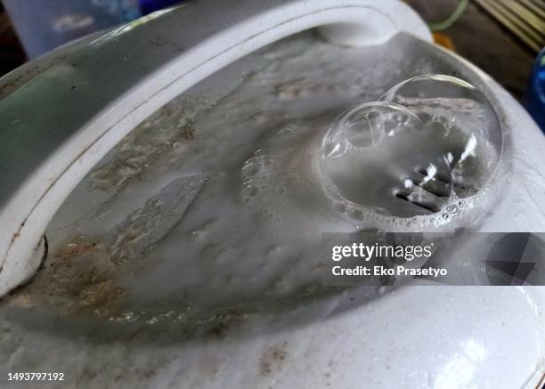 steam bubbles out between the lid of the rice cooker - dirty pan stock pictures, royalty-free photos & images
