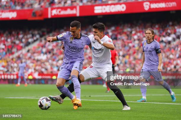 Lucas Vazquez of Real Madrid is put under pressure by Marcos Acuna of Sevilla FC during the LaLiga Santander match between Sevilla FC and Real Madrid...