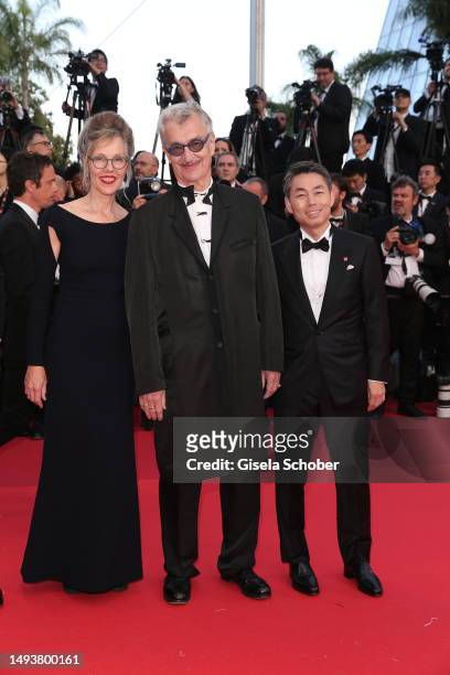 Donata Wenders, Wim Wenders and Koji Yanai attends the "Elemental" screening and closing ceremony red carpet during the 76th annual Cannes film...