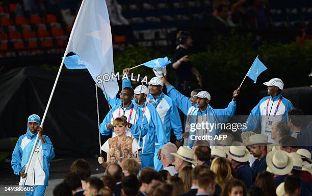 Somalia's flagbearer Zamzam Mohamed Farah leads her delegation in the opening ceremony of the London 2012 Olympic Games in the Olympic Stadium in...