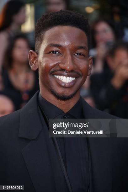Mamoudou Athie attends the "Elemental" screening and closing ceremony red carpet during the 76th annual Cannes film festival at Palais des Festivals...