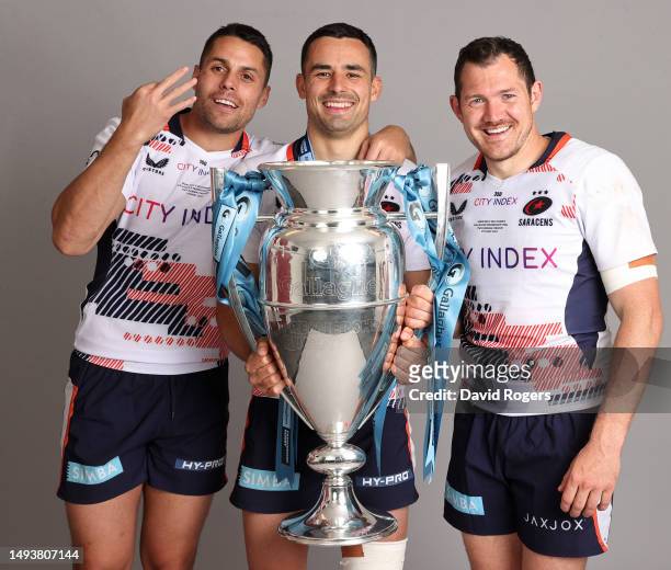Sean Maitland, Alex Lozowski and Alex Goode of Saracens pose for a photo with the Gallagher Premiership trophy after the team's victory in the...