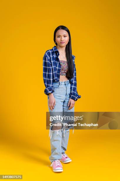 girl wearing ripped jeans - ripped jeans stock pictures, royalty-free photos & images