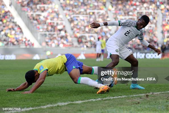 Augustine Njoku Of Nigeria Battles For The Ball With Kaiki Of Brazil augustine-njoku-of-nigeria-battles-for-the-ball-with-kaiki-of-brazil