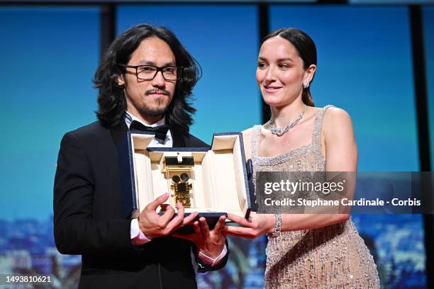 Thien An Pham, receives the Camera d'Or for "L'Arbre aux papillons d'or" and Anaïs Demoustier during the closing ceremony during the 76th annual...