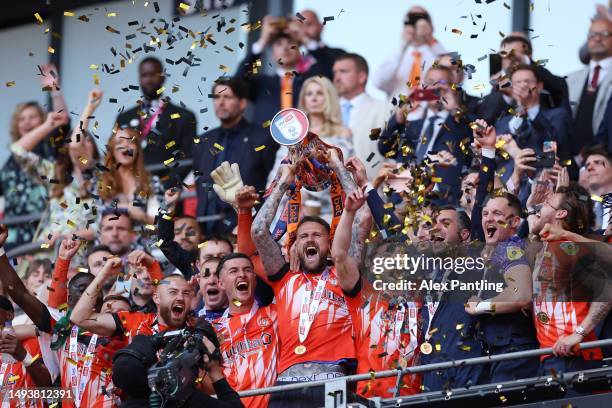 Sonny Bradley of Luton Town lifts the Sky Bet Championship Play Offs Final trophy following their team’s victory in the Sky Bet Championship Play-Off...