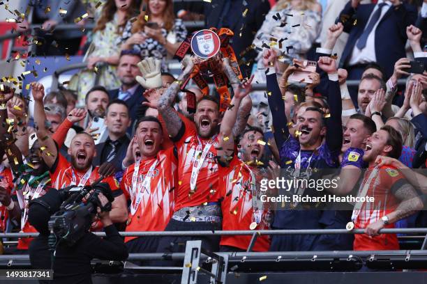Sonny Bradley of Luton Town lifts the Sky Bet Championship Play Offs Final trophy following their team’s victory in the Sky Bet Championship Play-Off...
