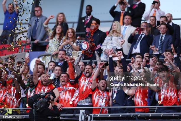Sonny Bradley of Luton Town lifts the Sky Bet Championship Play Offs Final trophy following their team’s victory in the Sky Bet Championship Play-Off...