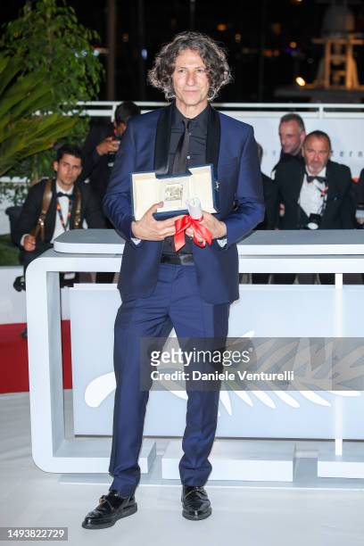 Jonathan Glazer poses with The Grand Prix Award for 'The Zone of Interest' during the Palme D'Or winners photocall at the 76th annual Cannes film...