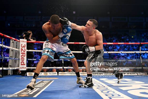 Nick Ball punches Ludumo Lamati during the Featherweight fight at The SSE Arena Belfast on May 27, 2023 in Belfast, Northern Ireland.