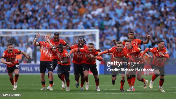 Luton Town players celebrate after Fankaty Dabo of Coventry City misses a penalty in the penalty shoot out which results in a promotion to the...