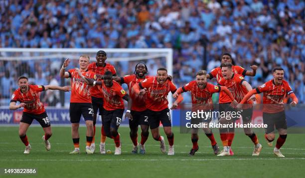 Luton Town players celebrate after Fankaty Dabo of Coventry City misses a penalty in the penalty shoot out which results in a promotion to the...