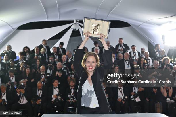 Justine Triet poses with The Palme D'Or Award for 'Anatomy of a Fall' during the Palme D'Or winners photocall at the 76th annual Cannes film festival...