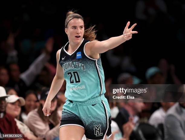 Sabrina Ionescu of the New York Liberty celebrates her three point shot in the second half against the Connecticut Sun at Barclays Center on May 27,...
