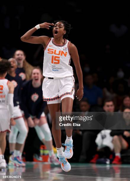 Tiffany Hayes of the Connecticut Sun celebrates her three point shot in the first half against the New York Liberty at Barclays Center on May 27,...