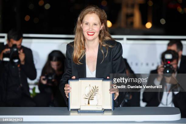 Justine Triet poses with The Palme D'Or Award for 'Anatomy of a Fall' during the Palme D'Or winners photocall at the 76th annual Cannes film festival...