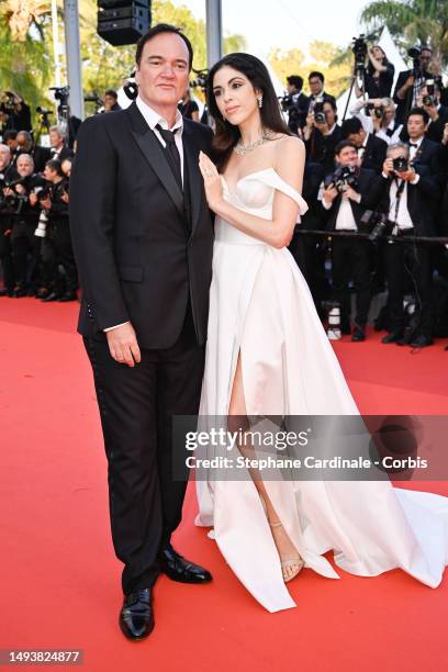 Quentin Tarantino and Daniella Pick attend the "Elemental" screening and closing ceremony red carpet during the 76th annual Cannes film festival at...