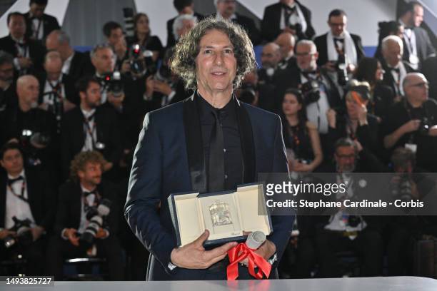 Jonathan Glazer poses with The Grand Prix Award for 'The Zone of Interest' during the Palme D'Or winners photocall at the 76th annual Cannes film...