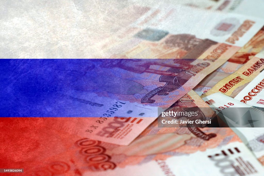 Flag of Russia and Russian rubles in cash