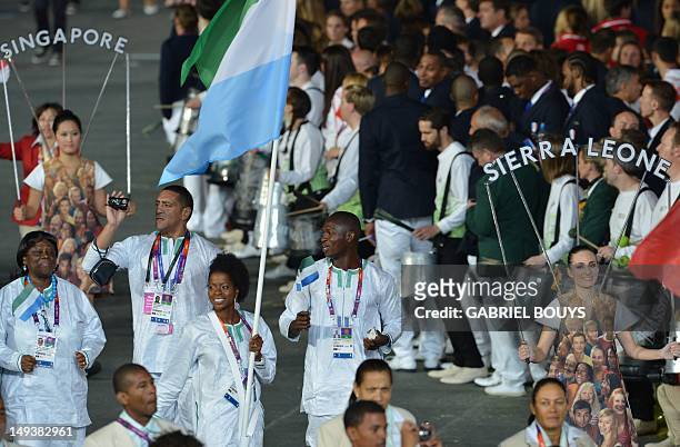Sierra Leone's flagbearer Ola Isata Sesay leads her delegation during the opening ceremony of the London 2012 Olympic Games on July 27, 2012 at the...