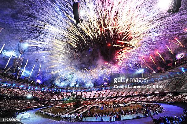 General view as fireworks illuminate the sky during the Opening Ceremony of the London 2012 Olympic Games at the Olympic Stadium on July 27, 2012 in...