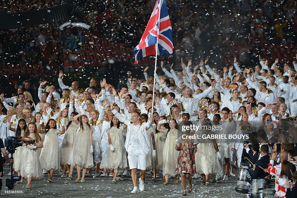 Britain's flagbearer Chris Hoy (C) leads