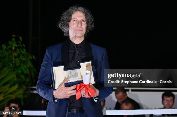 Jonathan Glazer poses withThe Grand Prix Award for 'The Zone of Interest' during the Palme D'Or winners photocall at the 76th annual Cannes film...