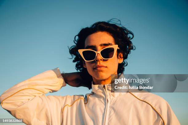 young man with cool attitude outdoor portrait - cool hairstyle stock pictures, royalty-free photos & images