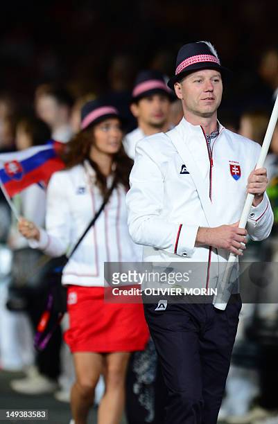 Slovakia's flagbearer Jozef Gonci carries his country's flag as he leads his country's delegation during the opening ceremony of the London 2012...