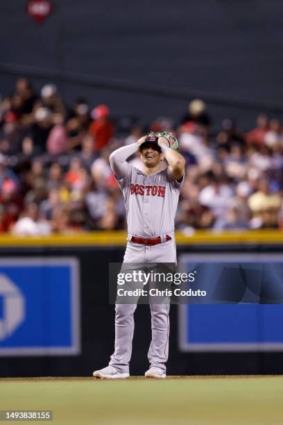 Enrique Hernandez of the Boston Red Sox reacts to a pitch clock violation during the game against the Arizona Diamondbacks at Chase Field on May 26,...