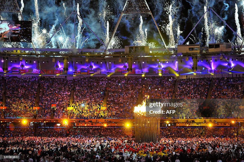 The Olympic Flame is lit during the open