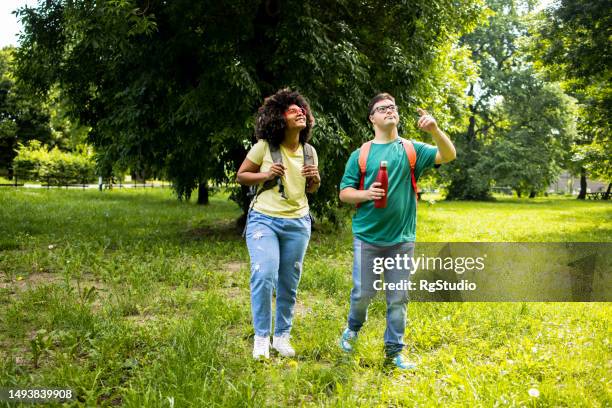 couple spends time in nature - black man walking studio stock pictures, royalty-free photos & images