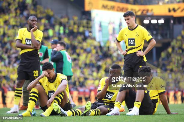 Players of Borussia Dortmund look dejected following the team's draw, as they finish second in the Bundesliga behind FC Bayern Munich during the...