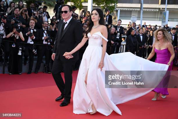 Quentin Tarantino and Daniella Pick attend the "Elemental" screening and closing ceremony red carpet during the 76th annual Cannes film festival at...