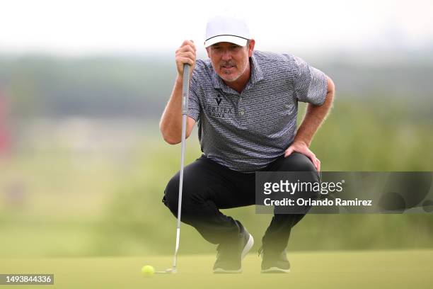 Paul Stankowski lines up a putt on the second green during the third round of the KitchenAid Senior PGA Championship at Fields Ranch East at PGA...